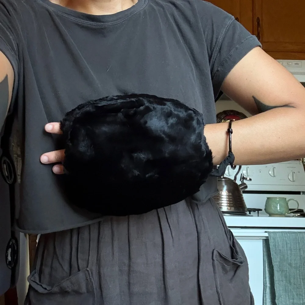 Vintage child’s seal fur muff hand warmer in black.
